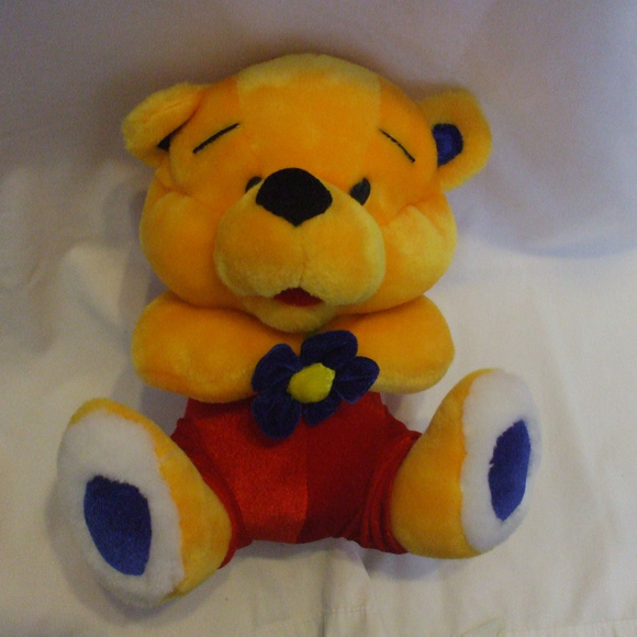Yellow Teddy Bear With Red Pants Holding Flower - Picture 2 of 4